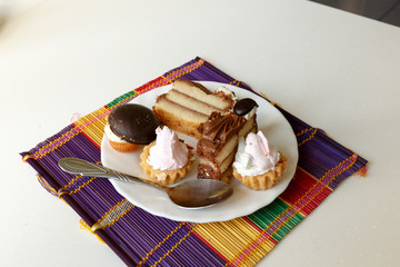 Cakes for a business lunch on a white dish