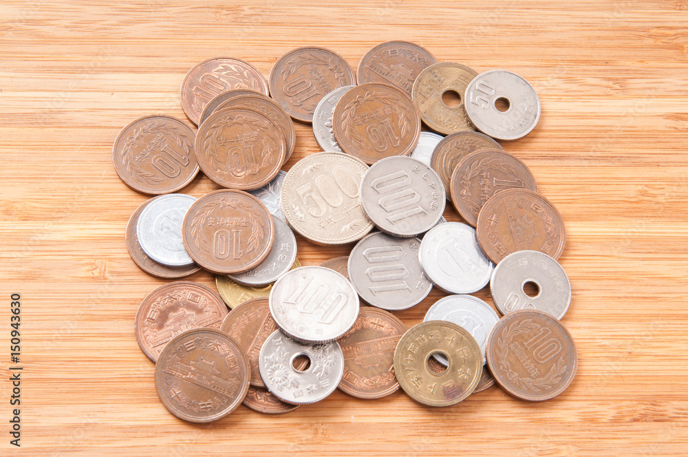 Wall mural japanese coins on wooden table.