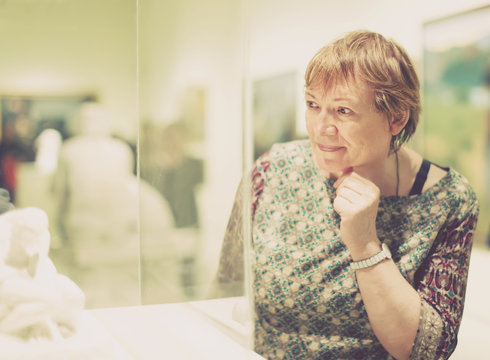 Portrait of senior woman visiting museum