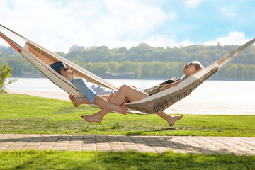 Contented couple relaxing in a hammock