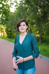 Modern multiracial woman during a walk in a city park