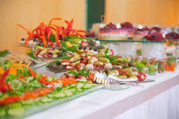 buffet, salads are on the table.