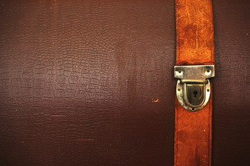 Vintage leather textured background with buckle.