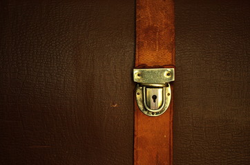 Vintage leather textured background with buckle.