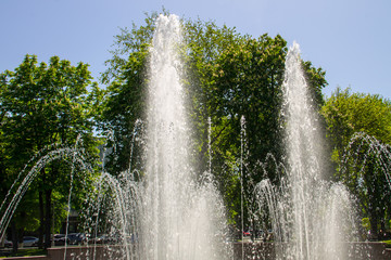 Splashes of fountain water in city park