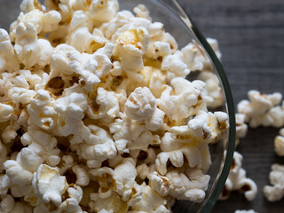 popcorn in a bowl on a wooden background