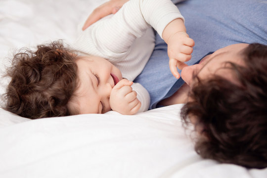 Baby Girl Touching Her Dad's Nose