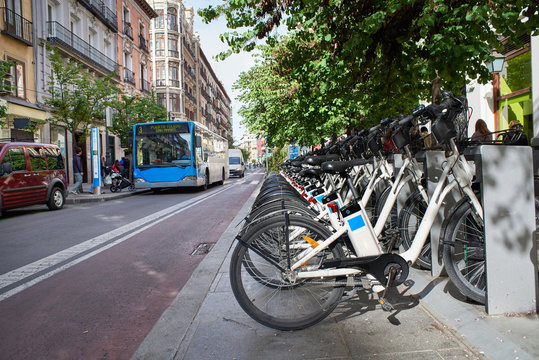 Fototapeta Rental of electric bicycles in city
