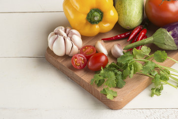 Organic food background vegetables on the cutting board.