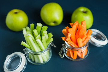 Healthy diet food. Carrots and celery chopped with chopsticks.