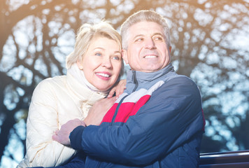 Fototapeta premium mature married couple sitting on park bench