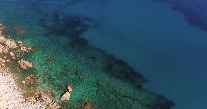 Aerial shot of a beautiful paradisiac sea near Elba island in Tuscany, Italy, 4K