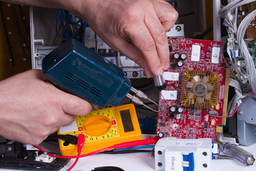 electrician fixing electrical device