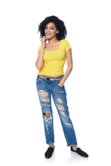Full length funky female in distressed jeans over white background