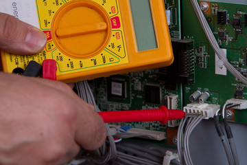 electrician fixing electrical device