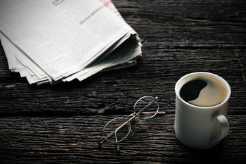 Morning coffee on old wood table Vintage tone