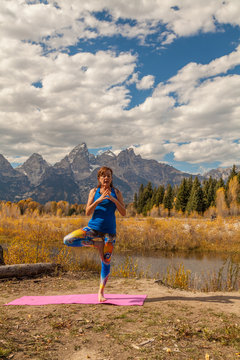 Woman Practicing Yoga in the Tetons in Autumn