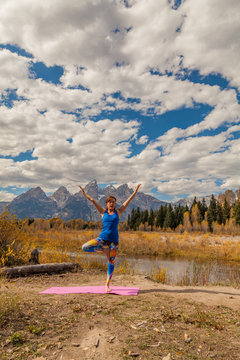 Woman Practicing Yoga in the Tetons in Autumn