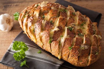  baked party bread with melted cheese butter herbs © Olga Miltsova