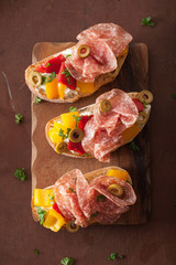 salami bruschetta with roasted peppers goat cheese olives
