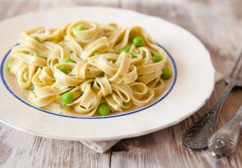 Italian pasta fettuccine with spinach