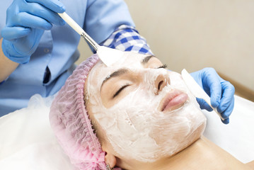 Process cosmetic mask of massage and facials in beauty salon 