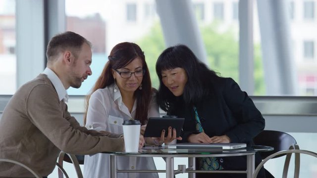 Group of business people using digital tablet