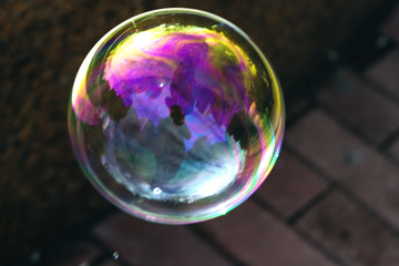 A beautiful soap bubble with reflections and overflows.