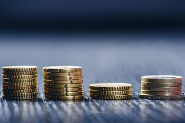 Euro money. Coins are isolated on a dark background. Currency of Europe. Balance of money. Building from coins. Coins of different values