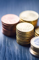 Euro money. Coins are isolated on a dark background. Currency of Europe. Balance of money. Building from coins. Coins of different values