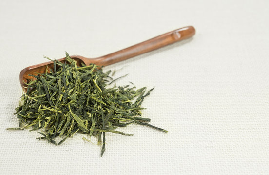 Tea leaf (Sencha) isolated on white background.