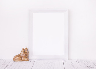 Stock photography of retro white frame template vintage wood table and cute ceramic doll