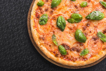 pizza with basil and tomat