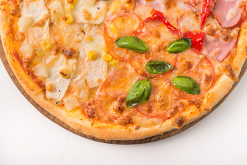 hot pizza with basil, pepperoni and bacon