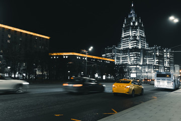 Cars in motion on the road in night city