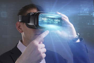 Business, Technology, Internet and network concept. Young businessman working in virtual reality glasses sees the inscription: Personal data protection