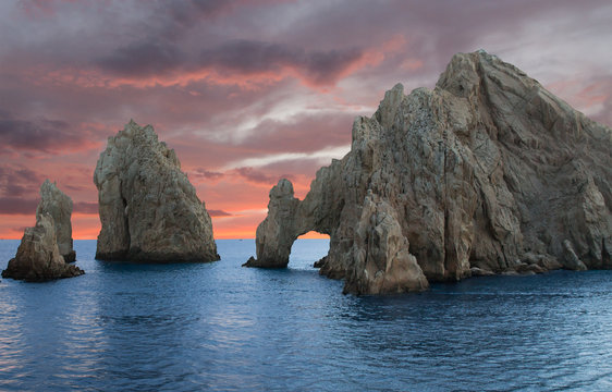 Beautiful large rocks in ocean at sunset Los Cabos Mexico