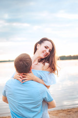 happy romantic couple in love and having fun at the lake outdoor in summer day, harmony concept