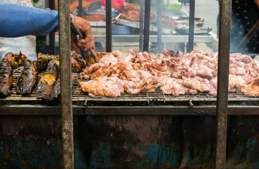 Hand holding for grill pork roast or barbecue is popular with tourists and Thailand people. This store can be seen everywhere in the country Thailand..