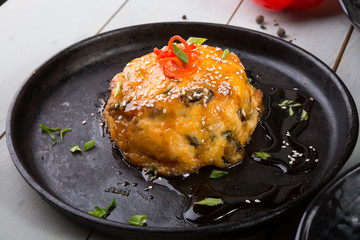 Salmon with mushrooms baked with cheese
