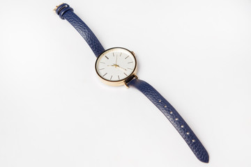 quartz watch on a blue leather strap