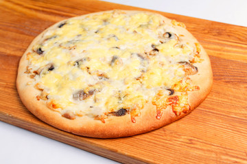 Pizza on a wooden board