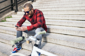Young man using mobile phone.
