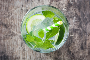 Mojito cocktail in glass on wooden background
