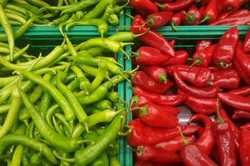Green chili and red chili in tray for selling in the market