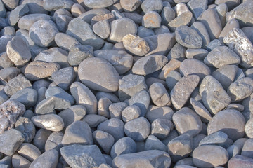 Pebble stones for background. Abstract background and texture with white pebbles. Stones texture and background. Garden decoration. Abstract texture and background for designers. 