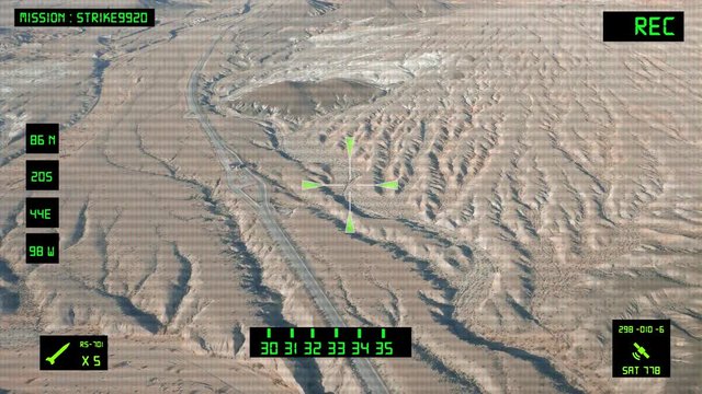 Viewfinder of a military helicopter / plane looking for a target to shoot and bomb. Desert area.