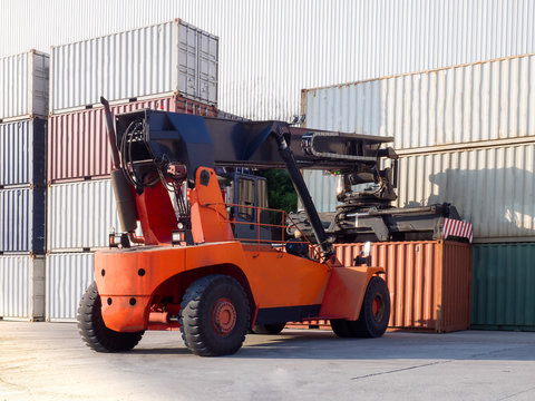 Full loaded container handling by Reachstacker in container yard