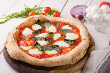 Pizza on wooden board