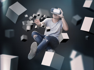 Visual reality concept.Young Asian man using Visual reality or VR headset man getting experience using VR-headset glasses.